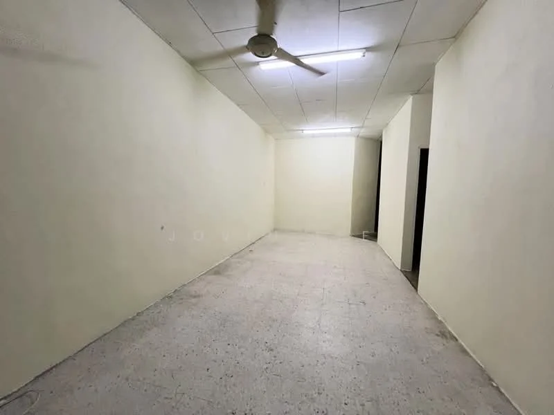 Room features: plain white walls, ceiling with fluorescent lighting, ceiling fan, tile flooring, no visible furniture, empty space, doorway to adjacent room, neutral color scheme; style: minimalist.