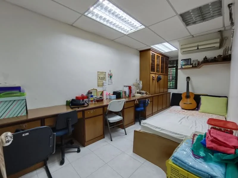Bedroom features: single bed with mattress, wooden headboard, built-in wooden cabinetry, study desk with chair, additional desk with chair, guitar on display, white tiled flooring, air conditioning unit, overhead fluorescent lighting, window with view to outside, shelves on wall, storage boxes, decorative items on shelves.