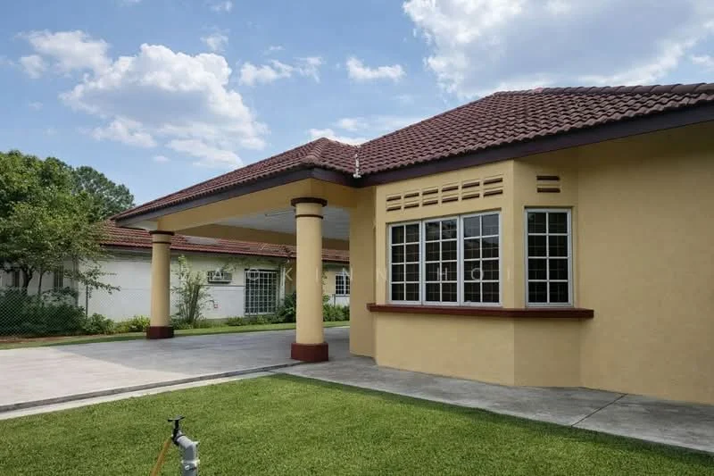 Exterior type: detached bungalow; features: yellow painted facade, red tiled roof, large windows with grid pattern, covered car porch, manicured lawn, concrete driveway, surrounded by greenery, single-storey, columns at porch, gutter system; style: modern.