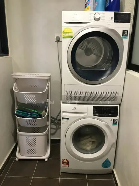 Laundry features: stacked front-load washing machine, front-load dryer, white appliances, grey tiled flooring, plastic laundry basket, shelves for storage, wall-mounted utility connections, neutral painted walls; style: modern.
