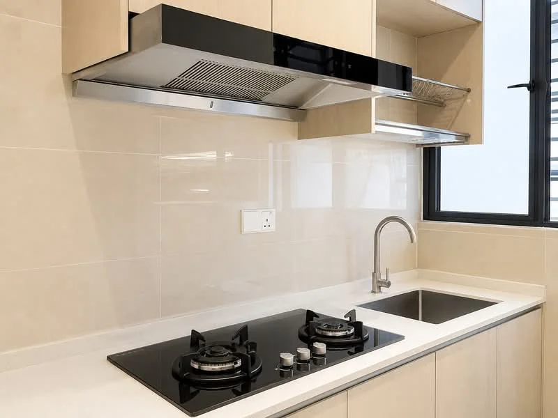 Kitchen features: black glass cooktop with 2 burners, stainless-steel range hood, single-bowl stainless-steel sink, chrome pull-down faucet, light beige cabinetry, white countertop, cream tiled backsplash, window with black frame; style: modern.