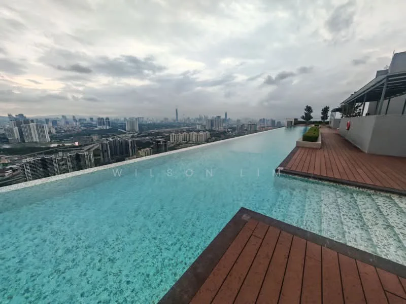 Exterior type: swimming pool deck; features: infinity pool, wooden deck, city skyline view, surrounded by high-rise buildings, landscaped edges, loungers along the poolside; style: modern.