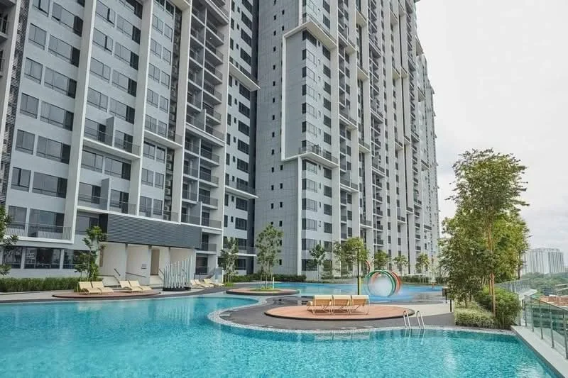 Exterior type: high-rise condominium; features: glass curtain wall, grey painted facade, infinity pool, pool deck with loungers, children's playground, manicured landscaping, mature trees, water feature, recessed balconies; style: modern.