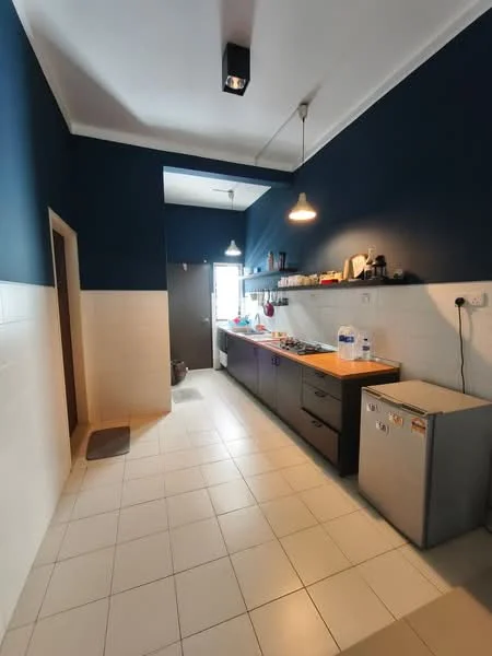 Kitchen features: blue painted walls, white tiled walls, white tile flooring, ceiling-mounted light fixture, 2 pendant lights, stainless-steel fridge, kitchen cabinets with dark finish, countertop with built-in stove, open shelving, window for natural light, door leading outside; style: modern.