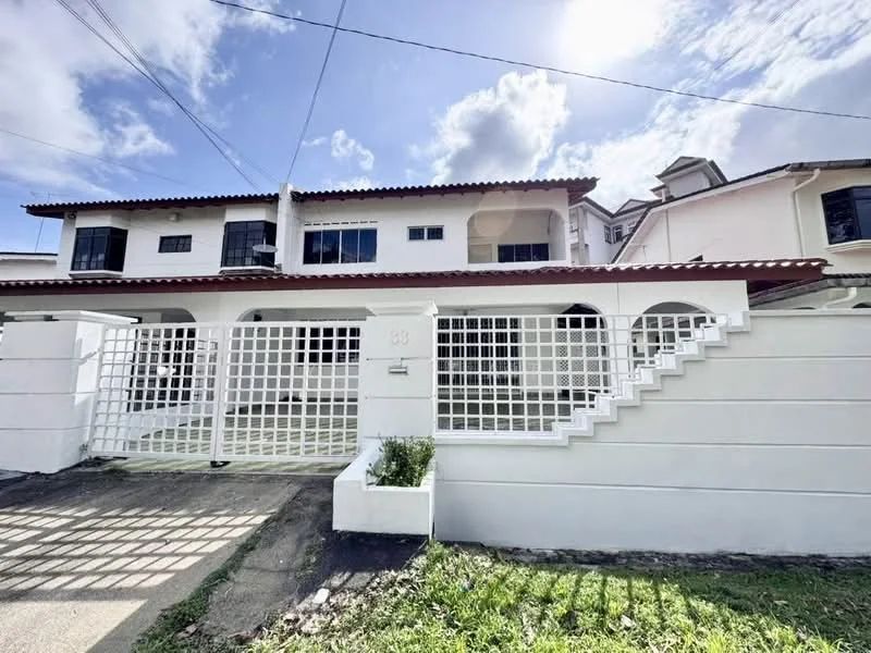 Exterior type: linked terrace house; features: white painted facade, terracotta tiled roof, grilled gate, front garden with grass, staircase leading to upper level, two-storey structure, windows with black frames, porch area, manicured lawn; style: modern.