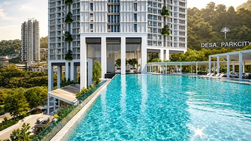 Exterior type: high-rise condominium; features: infinity pool with poolside loungers, glass curtain wall facade, landscaped garden area, surrounded by mature greenery, outdoor dining pavilion, recessed balconies, feature lighting at night; style: modern.