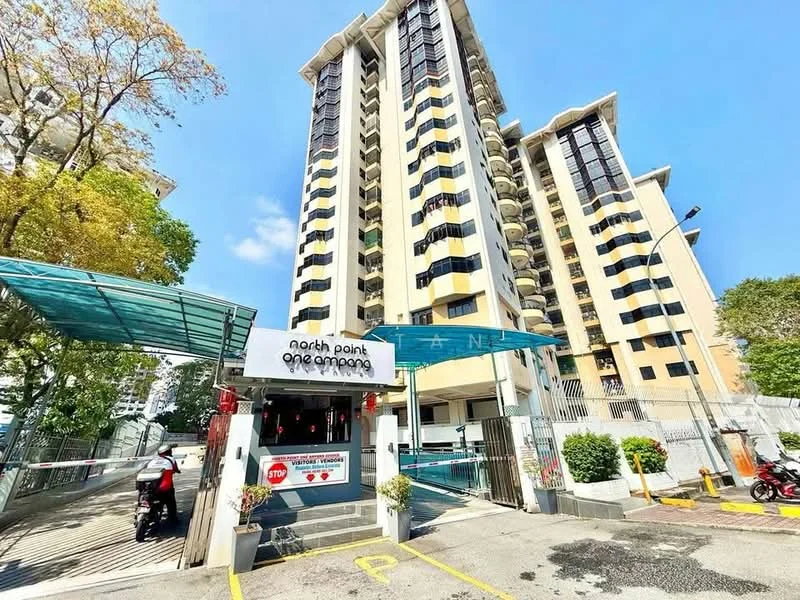 Exterior type: high-rise condominium; features: glass curtain wall, cream painted facade, recessed balconies, security gate, guard house at entrance, covered parking area, landscaped entrance, surrounded by mature greenery; style: modern.