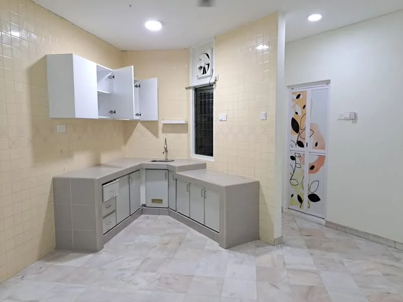 Kitchen features: L-shaped countertop, light grey laminate countertop, white upper cabinets, grey lower cabinets, stainless-steel sink, chrome faucet, cream tiled walls, marble tile flooring, window above sink, recessed ceiling lights; style: modern. Room features: cream painted walls, door with decorative design.