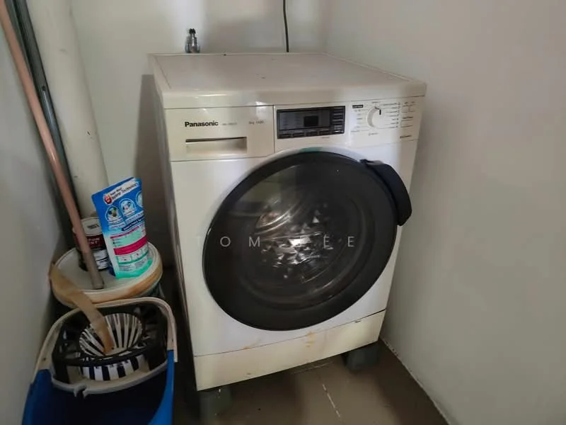Laundry features: front-load washing machine, Panasonic brand, detergent bottles, cleaning supplies, plastic laundry basket, tile flooring, white walls.