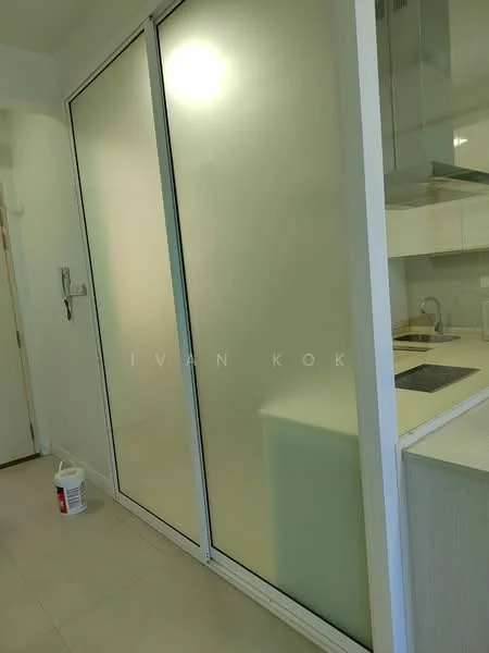 Room features: frosted glass sliding doors, white cabinetry, kitchen countertop, stainless-steel sink, built-in appliances, light-colored wall tiles, neutral-colored flooring, modern design; style: modern.