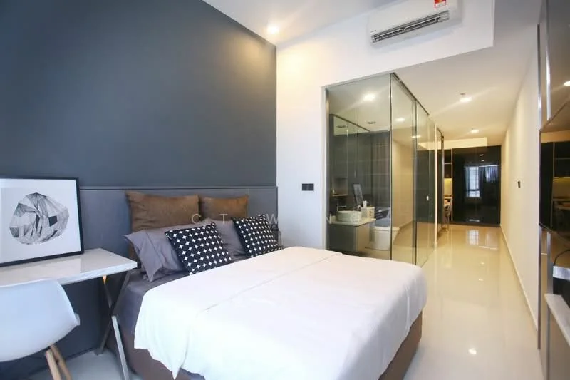 Bedroom features: queen-size bed with white bedding, upholstered headboard, decorative pillows, study desk with white chair, framed artwork, glass partition to bathroom, wall-mounted air conditioning unit, recessed ceiling lights, polished tile flooring, dark accent wall, built-in wardrobe, sliding glass door, floor-to-ceiling windows; style: modern.