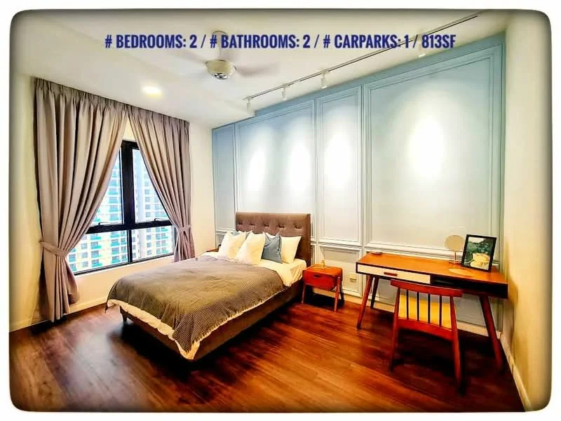 Bedroom features: king-size bed with upholstered headboard, two bedside lamps, wooden flooring, floor-to-ceiling window with city view, grey curtains, decorative wall paneling, study desk with chair, wall-mounted ceiling fan; style: modern; view: city.