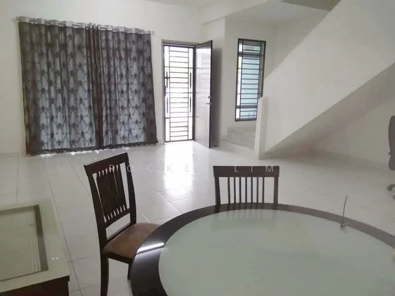 Room features: white painted walls, white tiled flooring, large windows with black metal grills, curtains with geometric pattern, dining table with glass top, wooden dining chairs, staircase leading to upper floor, open layout, door leading outside; style: modern.