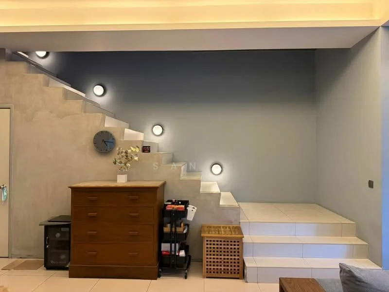 Room features: staircase with wall-mounted lights, light grey painted walls, cream tiled flooring, wooden dresser, decorative clock on wall, small storage cart, woven storage basket, minimalist decor; style: modern.