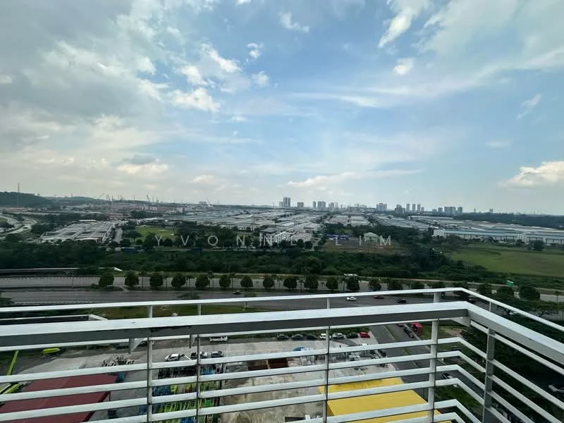 Exterior type: high-rise condominium; features: balcony with railing, city skyline view, surrounded by greenery, industrial area in the distance, highway visible below, open sky, cloudy weather; style: modern.