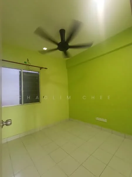 Room features: green painted walls, white tiled flooring, ceiling fan, window with grille, light fixture, baseboard, no visible furniture.
