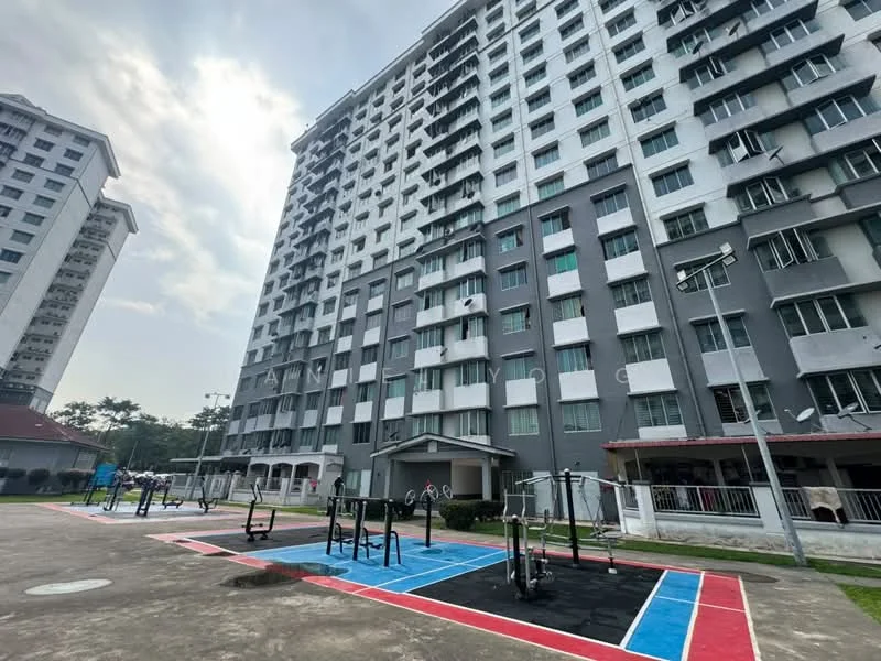 Exterior type: mid-rise condominium; features: grey painted facade, multiple storeys, balconies on upper floors, outdoor gym area with fitness equipment, paved exercise area with colored markings, surrounding landscaped area, parking area visible, security lighting, adjacent covered structure, manicured lawn; style: modern.