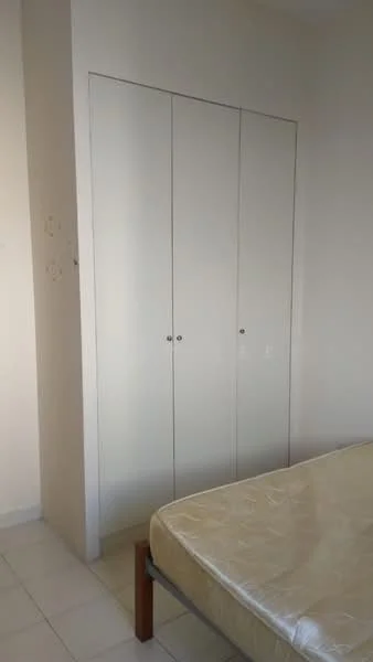 Bedroom features: built-in wardrobe with sliding doors, white painted walls, tile flooring, queen-size bed frame, mattress on bed frame.