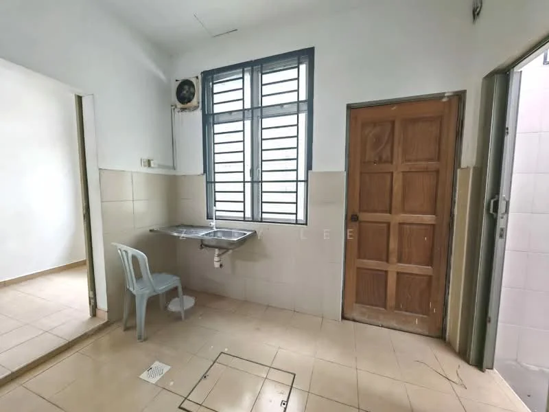 Room features: white painted walls, tile flooring, single window with metal grille, wooden door, sink with wall-mounted faucet, plastic chair, exposed electrical outlet, floor drain; style: minimalist.