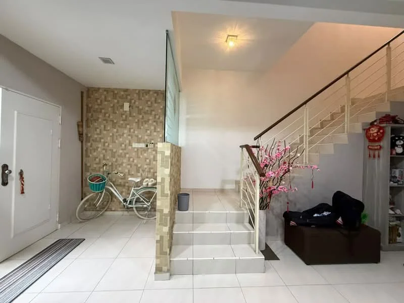 Room features: white painted walls, cream tiled flooring, staircase with metal railing, decorative wall with stone cladding, wall-mounted light fixture, bicycle against the wall, decorative plant, small storage cabinet, door with metal handle, open space layout; style: modern.