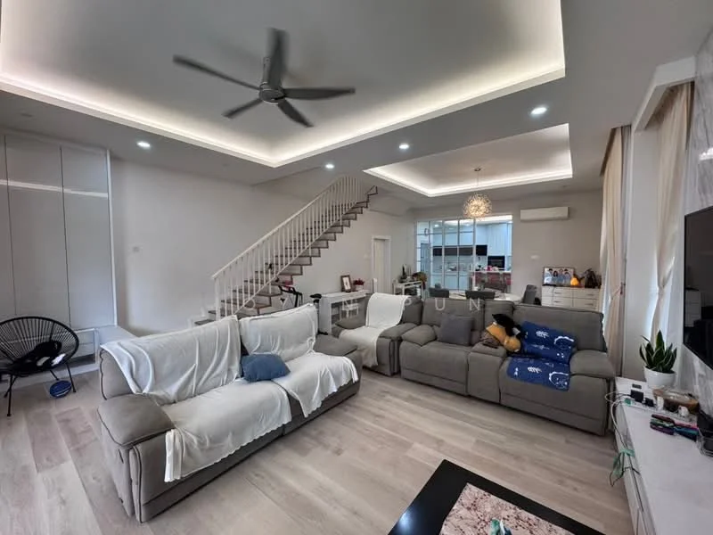 Living features: 5-blade ceiling fan with integrated LED light, L-shape sectional sofa in grey, 2-seater fabric sofa, coffee table, TV console, wall-mounted TV, area rug, white painted walls, light wood flooring, staircase with white railing, recessed lighting, large windows with sheer curtains; style: modern.