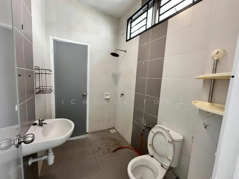 Bathroom features: white tiled walls, grey tiled accent wall, shower with wall-mounted shower head, single-sink vanity with chrome faucet, toilet, shelf unit, floor tile, window for natural light.