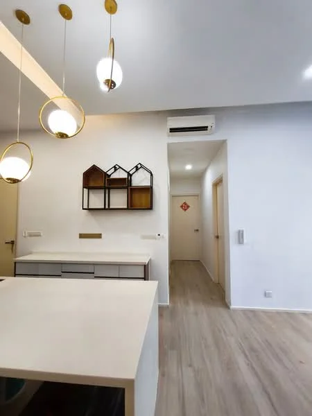 Kitchen features: pendant lighting with gold accents, white cabinetry, light wood countertop, open shelving with decorative boxes, light wood flooring, wall-mounted split AC, neutral painted walls, kitchen island; style: modern. Hallway features: neutral painted walls, light wood flooring, doorway leading to other rooms.