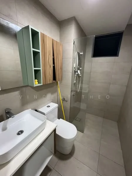 Bathroom features: single-sink vanity with white countertop, wall-mounted mirror, wood cabinetry, glass shower enclosure, handheld shower, toilet, grey tiled walls, light grey tiled flooring, window for natural light, yellow rubber duck decoration; style: modern.