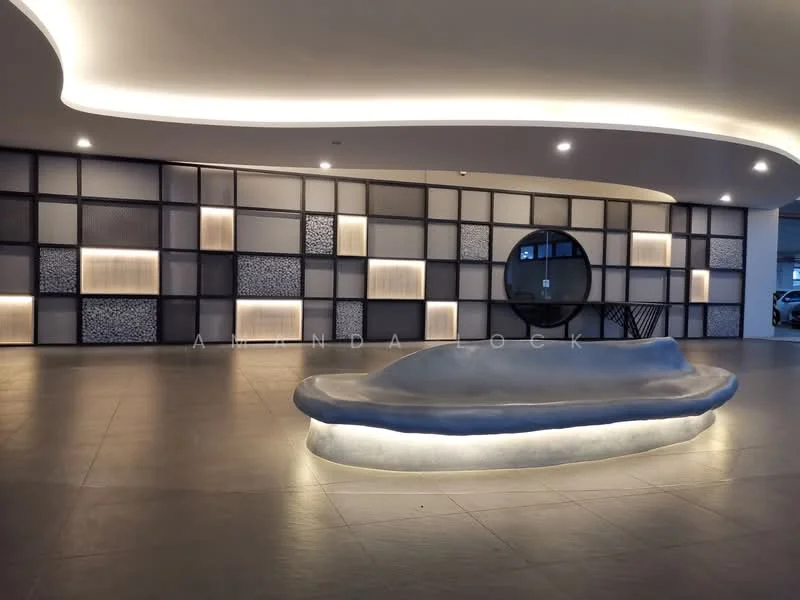 Room features: modern reception area, curved stone bench with integrated lighting, textured wall panels, ambient lighting, large circular window, grey tiled flooring, decorative wall with geometric patterns, backlit wall features; style: modern.