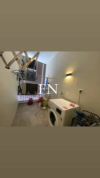 Laundry features: front-load washing machine, clothes drying rack, wall-mounted light fixture, tile flooring, window with blinds, laundry basket, shelving unit, utility sink.