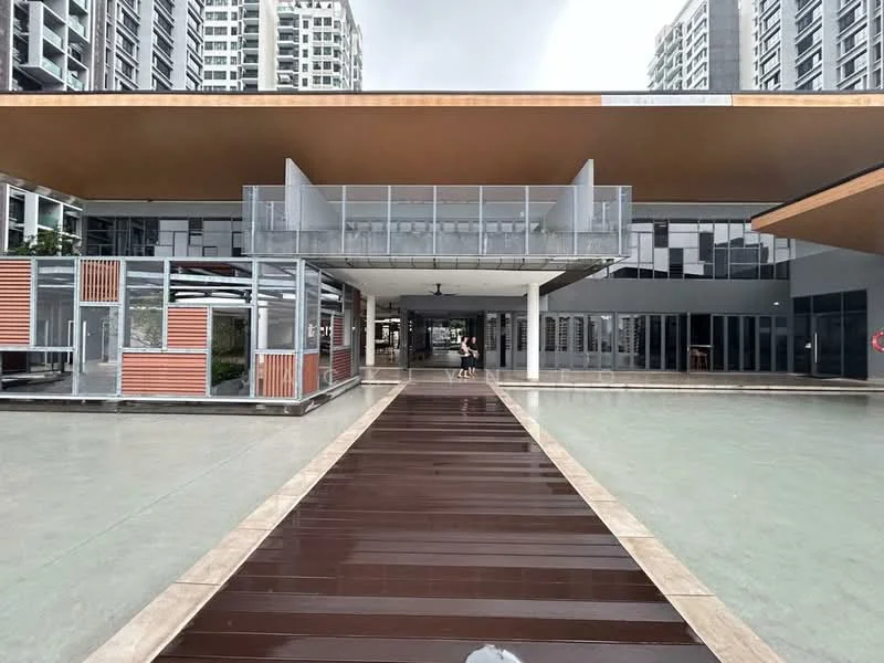 Exterior type: clubhouse; features: flat roof, glass facade, wooden deck walkway, large glass windows, outdoor seating area, manicured landscaping, covered entrance, open-air design, modern architectural style; style: modern.