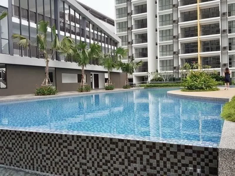 Exterior type: high-rise condominium; features: infinity pool, pool deck with loungers, tropical landscaping, palm trees, manicured lawn, glass curtain wall facade, multiple storeys, surrounded by greenery; style: modern.