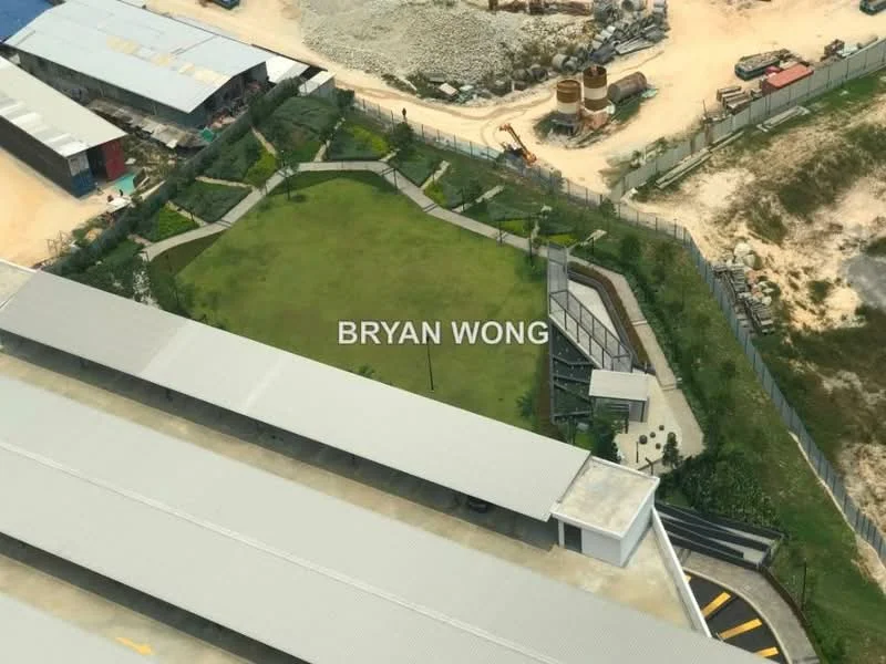 Exterior features: manicured lawn, surrounding fence, landscaped garden, paved walkway, parking area, construction materials visible in background.