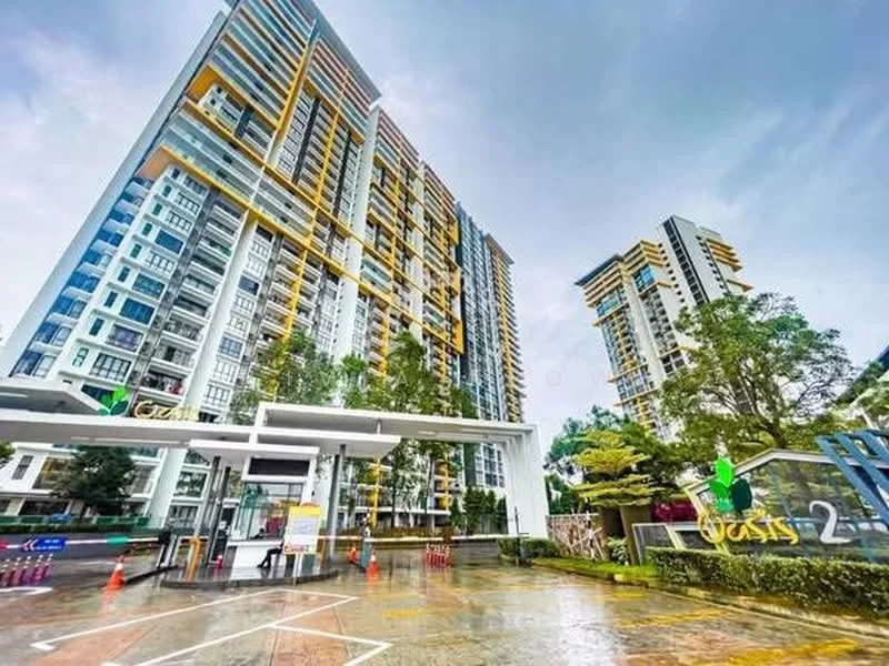 Exterior type: high-rise condominium; features: glass curtain wall, yellow accent panels, multiple balconies, manicured landscaping, entrance gate with security, driveway with interlocking pavers, surrounded by greenery, adjacent to other high-rise buildings; style: modern.