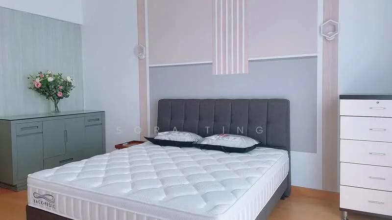 Bedroom features: queen-size bed with grey upholstered headboard, white mattress with quilted cover, nightstand beside bed, light grey accent wall, wooden flooring, built-in wardrobe with grey cabinetry, decorative wall light fixture, floral arrangement in vase, white chest of drawers, minimalist decor; style: modern.