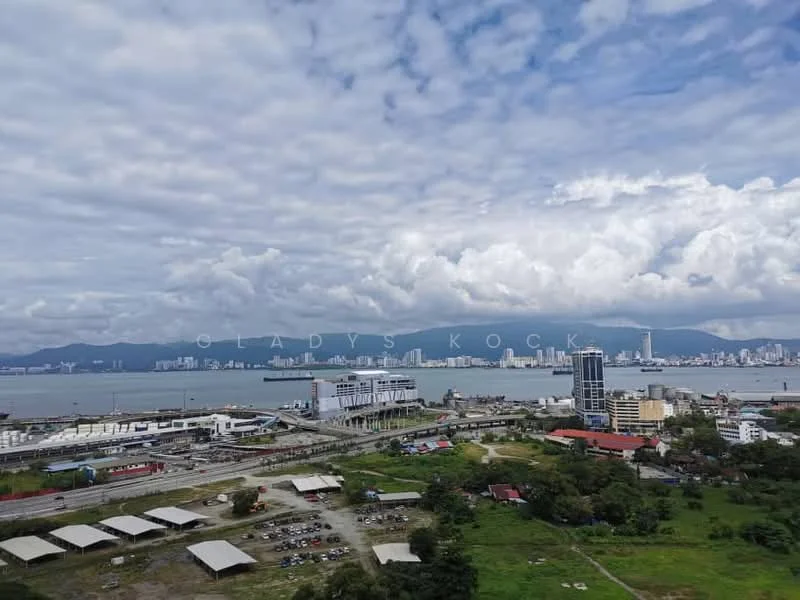 Exterior features: city skyline view, waterfront, cloudy sky, distant mountains, urban landscape, mixed-use development, open space, commercial buildings, greenery in foreground; style: modern.