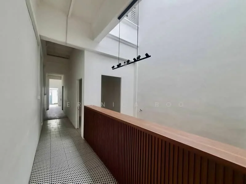Room features: white painted walls, exposed ceiling beams, black and white patterned tile flooring, wooden railing, hanging light fixture, doorways leading to other rooms; style: modern.