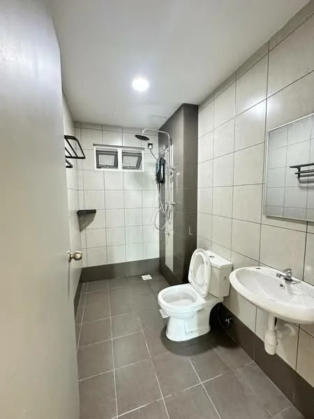 Bathroom features: grey tiled walls, white ceramic sink, chrome basin mixer, one-piece toilet, walk-in shower with glass partition, shower head, mirror, wall-mounted towel rack, dark grey tiled flooring, built-in shelf, recessed lighting; style: modern.