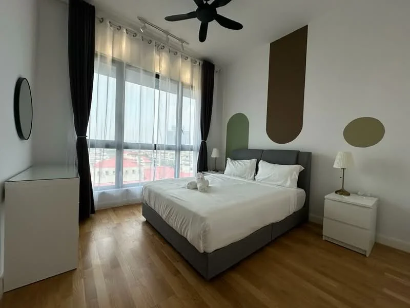 Bedroom features: king-size bed with grey upholstered headboard, white bedding, 2 bedside tables, table lamp on bedside table, white dresser, floor-to-ceiling windows with sheer curtains, wooden flooring, decorative wall accents in green and brown, ceiling fan, wall mirror; style: modern; view: city.