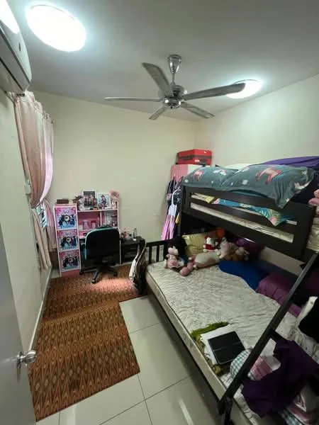 Bedroom features: bunk bed with mattress, single bed with mattress, ceiling fan, two ceiling lights, pink curtains, wooden flooring, decorative wall with posters, study desk, chair, stuffed animals, area rug with geometric pattern.