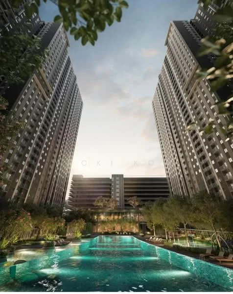 Exterior type: high-rise condominium; features: two tall residential towers, infinity pool, pool deck with loungers, landscaped garden with tropical plants, manicured lawn, surrounding greenery, parking structure visible, evening sky, water features, outdoor seating areas; style: modern.