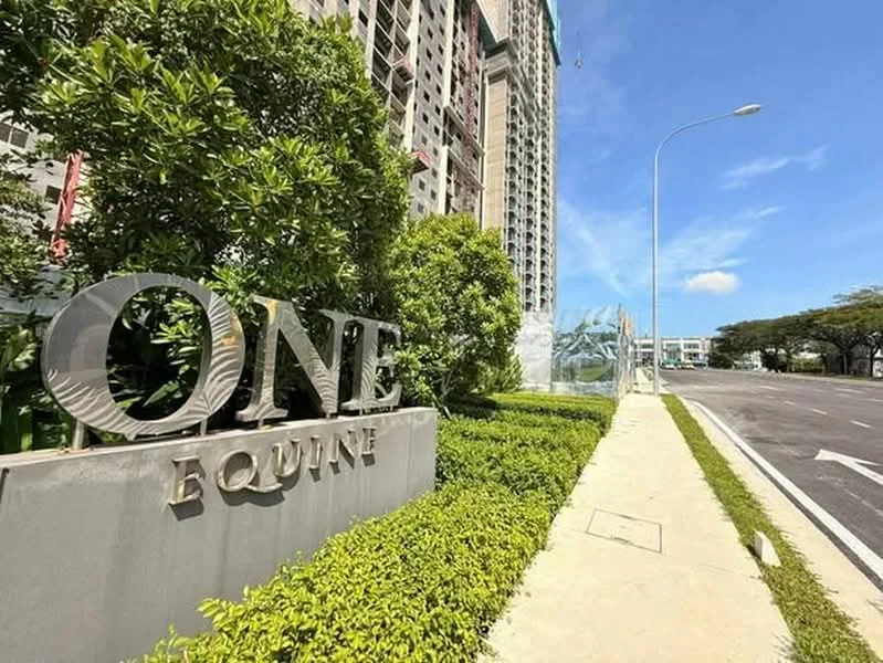 Exterior type: high-rise condominium; features: landscaped greenery, signage with 'ONE EQUINE', paved walkway, surrounding trees, urban street view, clear blue sky; style: modern.