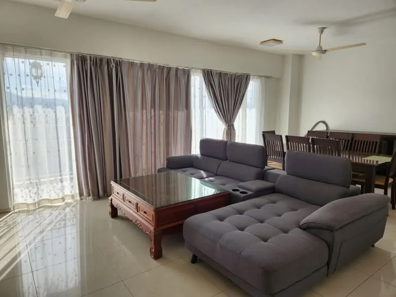 Living features: L-shape sectional sofa in grey, glass coffee table, wooden dining table with chairs, floor-to-ceiling windows, sheer curtains, dark grey curtains, tile flooring, ceiling fan with light, decorative wall, natural light from windows; style: modern; view: city.