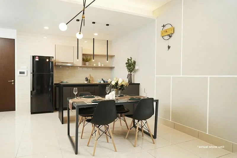 Kitchen features: black cabinetry, white countertops, stainless-steel fridge, built-in oven, 4-burner gas hob, kitchen island, pendant lighting, dining table with 4 chairs, decorative wall clock, white tiled backsplash, ceramic tile flooring, greenery in vase; style: modern.