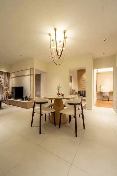 Dining features: round dining table, 4 upholstered dining chairs, chandelier light fixture, wall-mounted TV, light-colored walls, large windows with sheer curtains, tile flooring, decorative plant on table; style: modern. Living features: TV console, light-colored cabinetry, sofa, decorative wall paneling; style: modern.