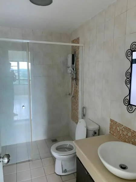 Bathroom features: glass shower enclosure, rain shower head, handheld shower, single-sink vanity with countertop, round vessel sink, chrome basin mixer, toilet, tile flooring, light-colored wall tiles, decorative mosaic accent wall, wall-mounted shower unit, mirror with decorative frame; style: modern.