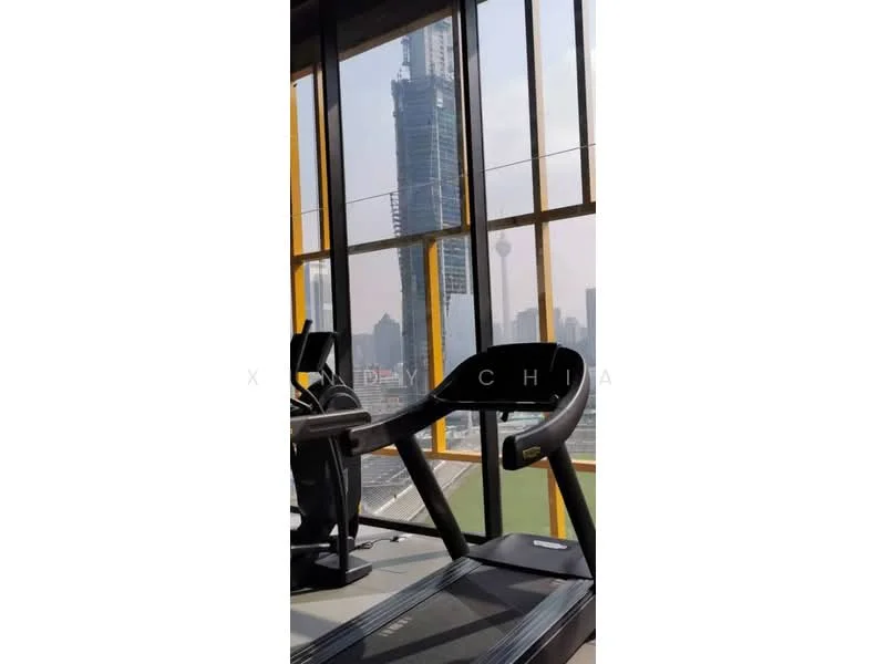 Room features: treadmill, large windows, city skyline view, modern fitness equipment, wooden flooring, bright natural light, open space, high ceiling; style: modern; view: city.
