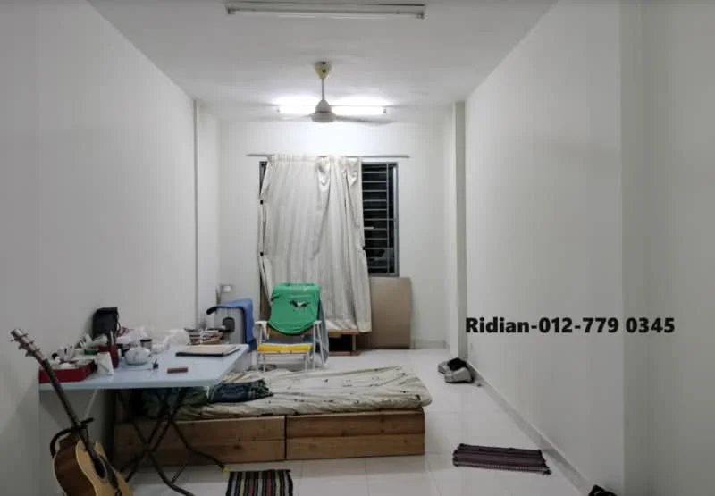 Room features: white painted walls, white ceiling, tile flooring, single ceiling light, window with sheer curtains, wooden bed frame with mattress, blue plastic chair, table with various items, guitar, folding chair; style: minimalist.