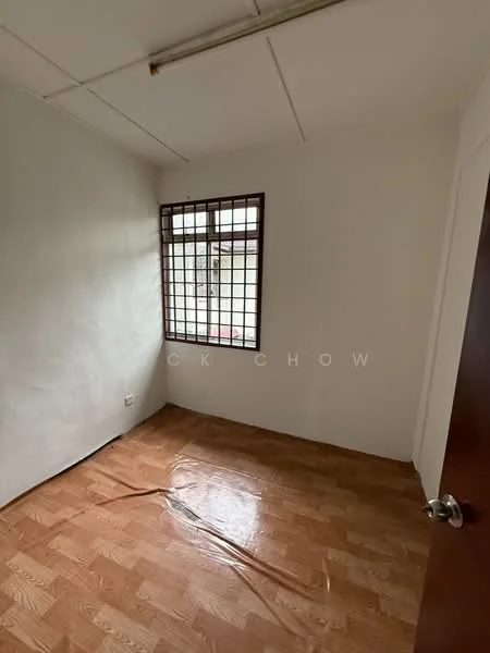 Room features: white painted walls, wooden flooring, single window with grid, ceiling light fixture, door with wooden finish.