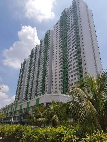 Exterior type: high-rise condominium; features: white painted facade, green accent balconies, multiple storeys, glass windows, landscaped garden in foreground, tropical landscaping with palm trees, commercial units at ground level, clear blue sky, urban setting; style: modern.